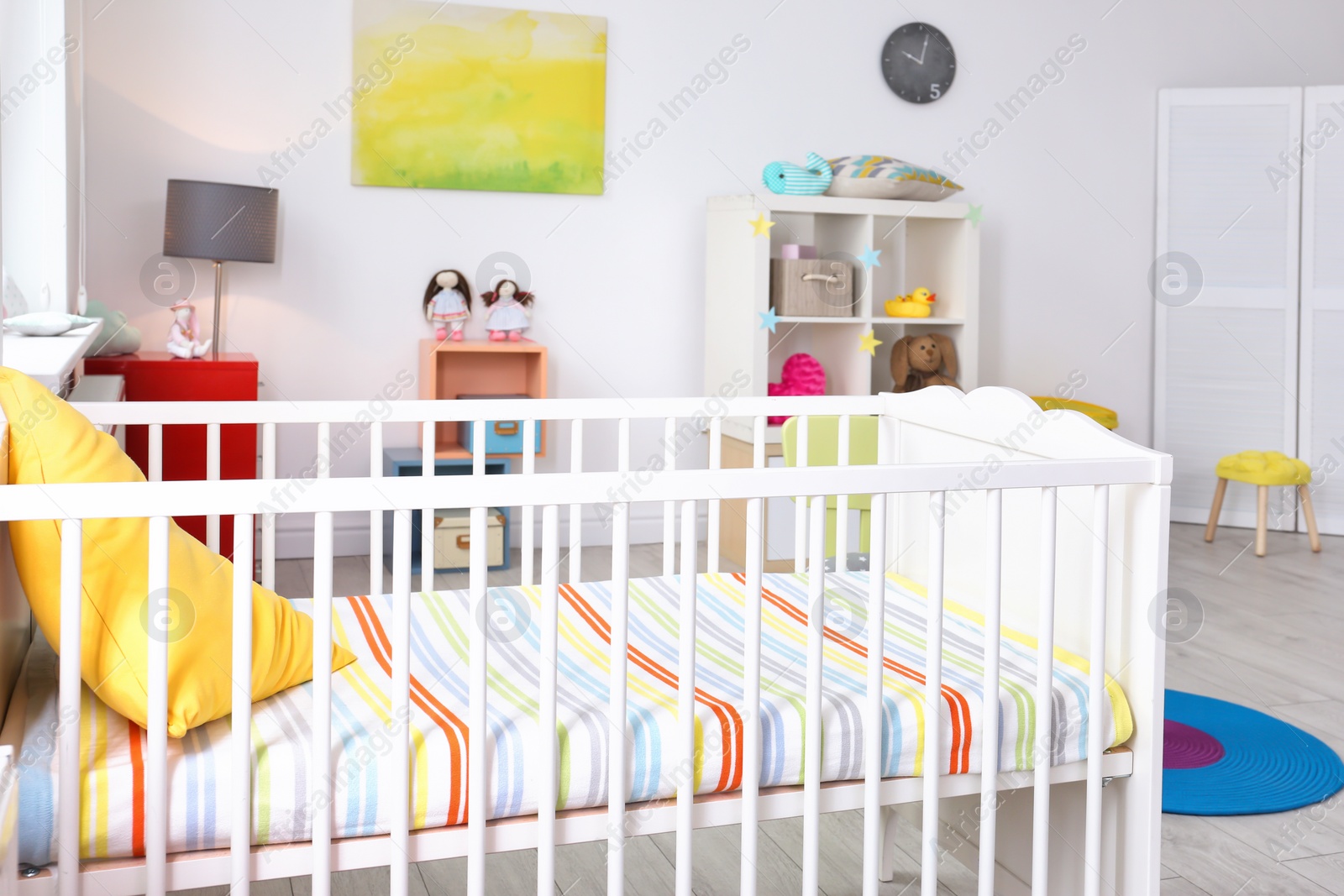 Photo of Baby room interior with comfortable crib