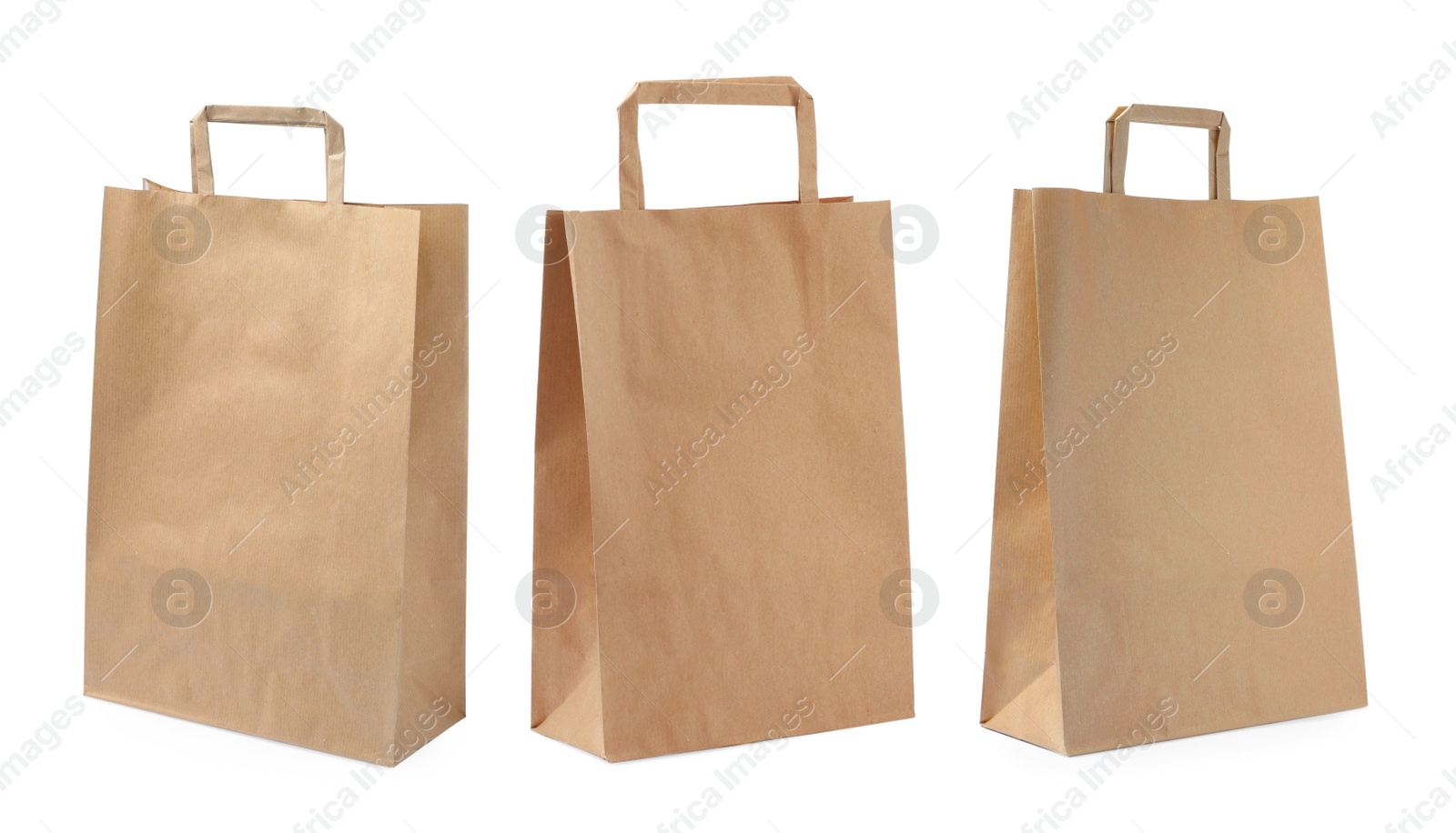 Image of Set with kraft paper bags on white background