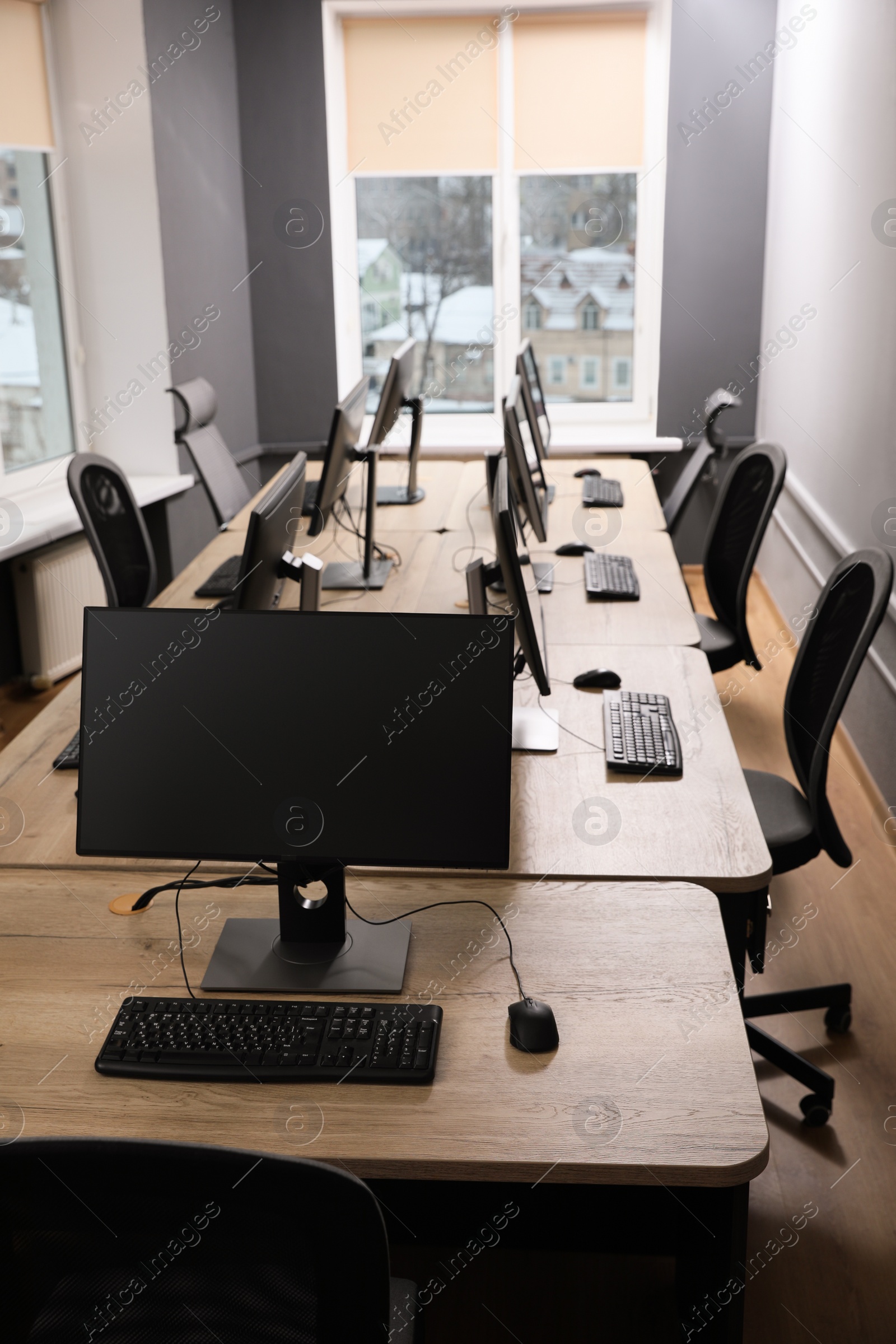 Photo of Many modern computers in open space office