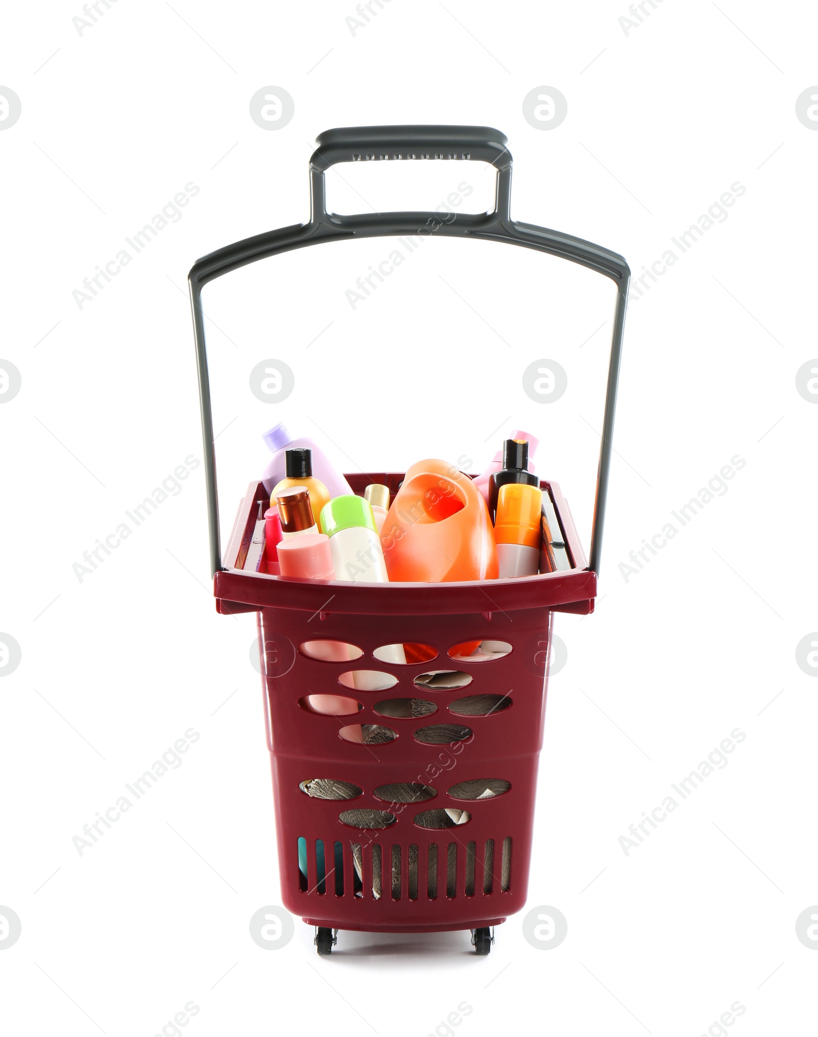 Photo of Shopping basket full of cleaning supplies isolated on white