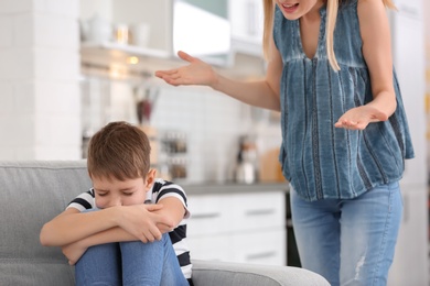 Photo of Mother arguing with son at home