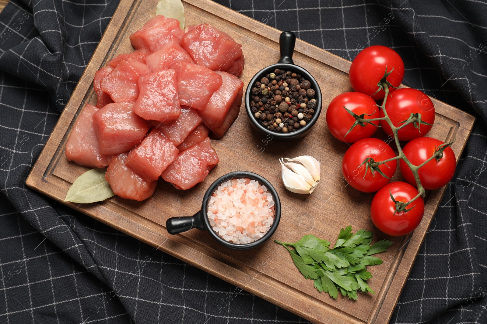 Photo of Raw beef meat and different ingredients for cooking delicious goulash on table, top view