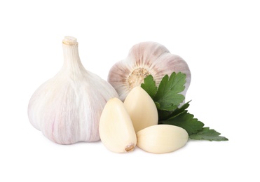 Photo of Fresh garlic bulbs and cloves with parsley on white background. Organic food