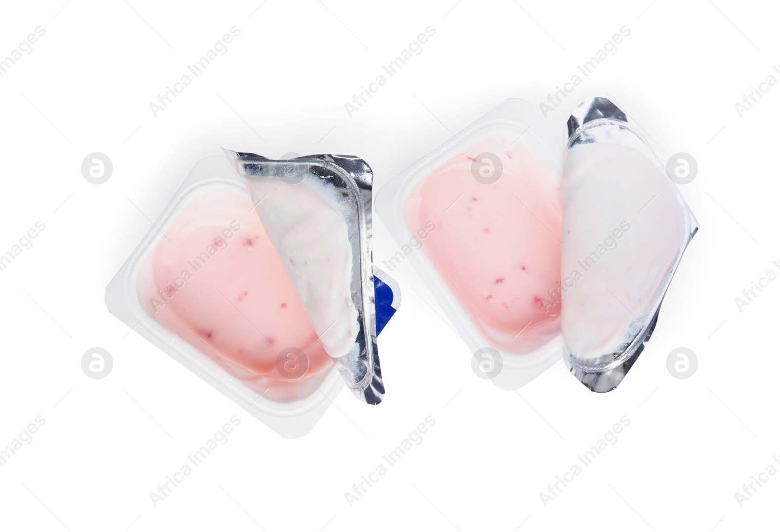 Photo of Tasty organic yogurt in plastic cups isolated on white, top view