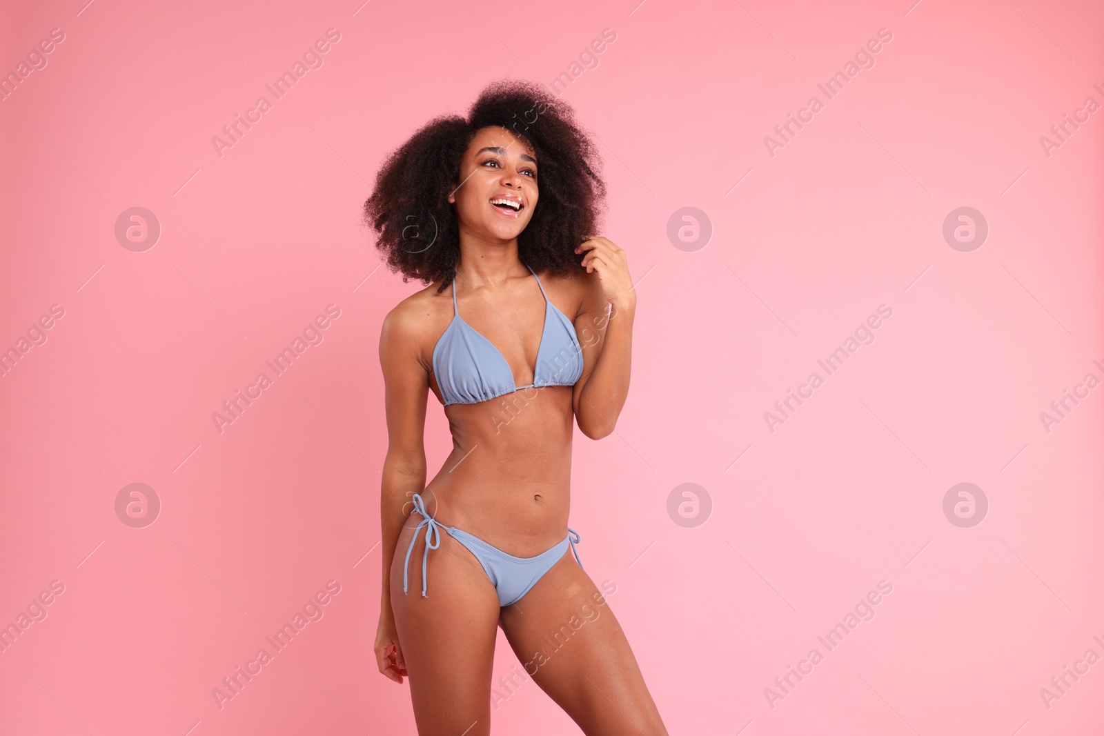 Photo of Beautiful woman in stylish bikini on pink background