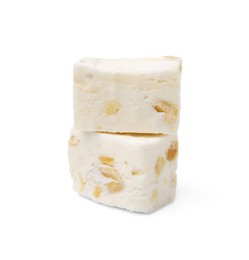 Photo of Pieces of delicious nougat on white background