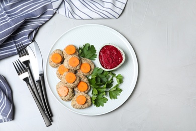 Photo of Flat lay composition with plate of traditional Passover (Pesach) gefilte fish  on light background. Space for text