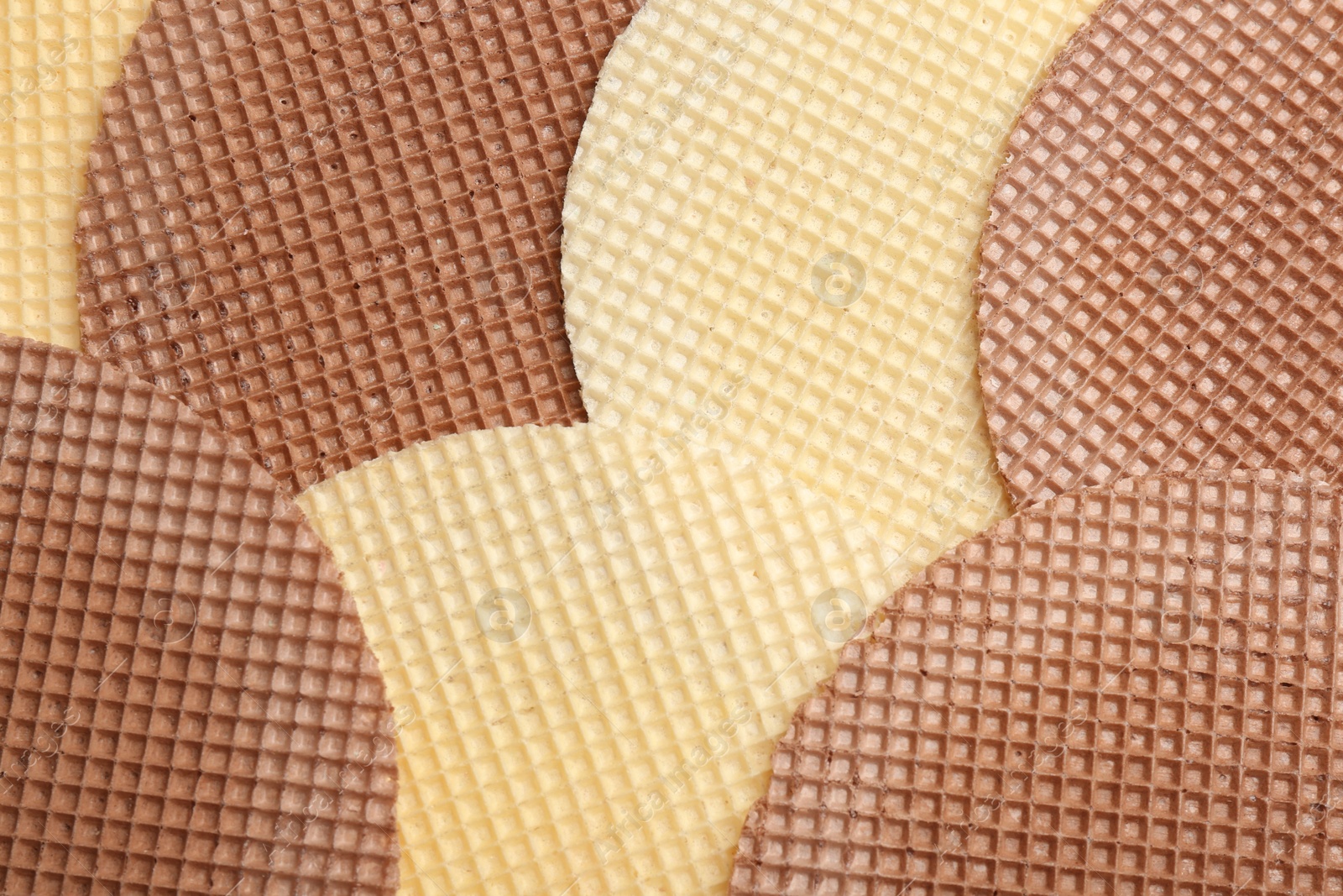 Photo of Tasty wafers as background, closeup. Crispy food