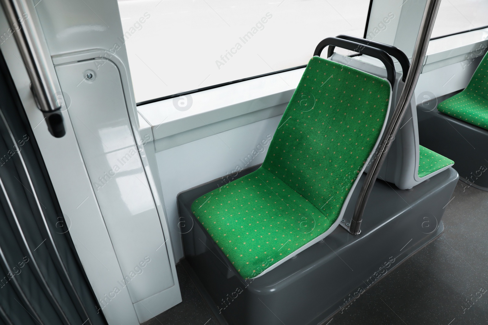 Photo of Public transport interior with comfortable green seats