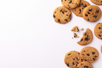 Delicious chocolate chip cookies on white background, flat lay. Space for text