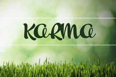 Image of Word KARMA on blurred green background, bokeh effect 