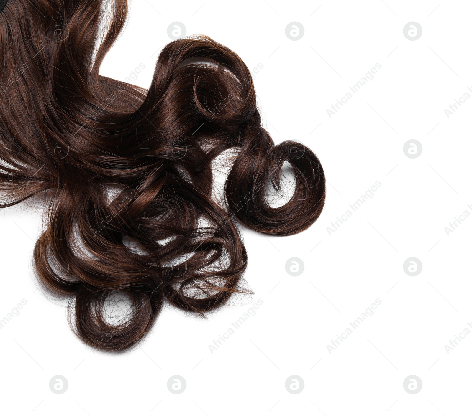 Photo of Beautiful dark brown curly hair isolated on white, top view