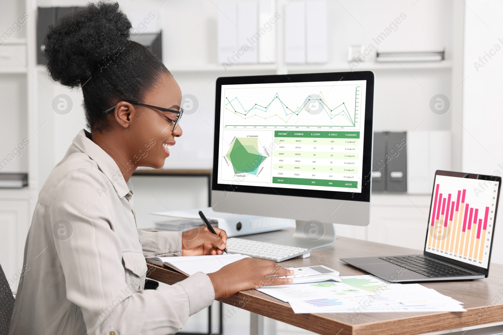 Photo of Professional accountant working at wooden desk in office