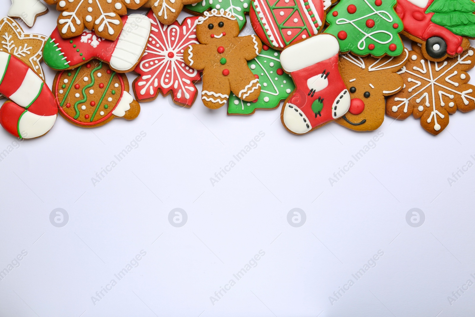 Photo of Different tasty Christmas cookies on white background, flat lay. Space for text