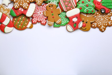 Photo of Different tasty Christmas cookies on white background, flat lay. Space for text