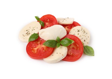 Photo of Delicious Caprese salad with tomatoes, mozzarella cheese, basil leaves and herbs isolated on white