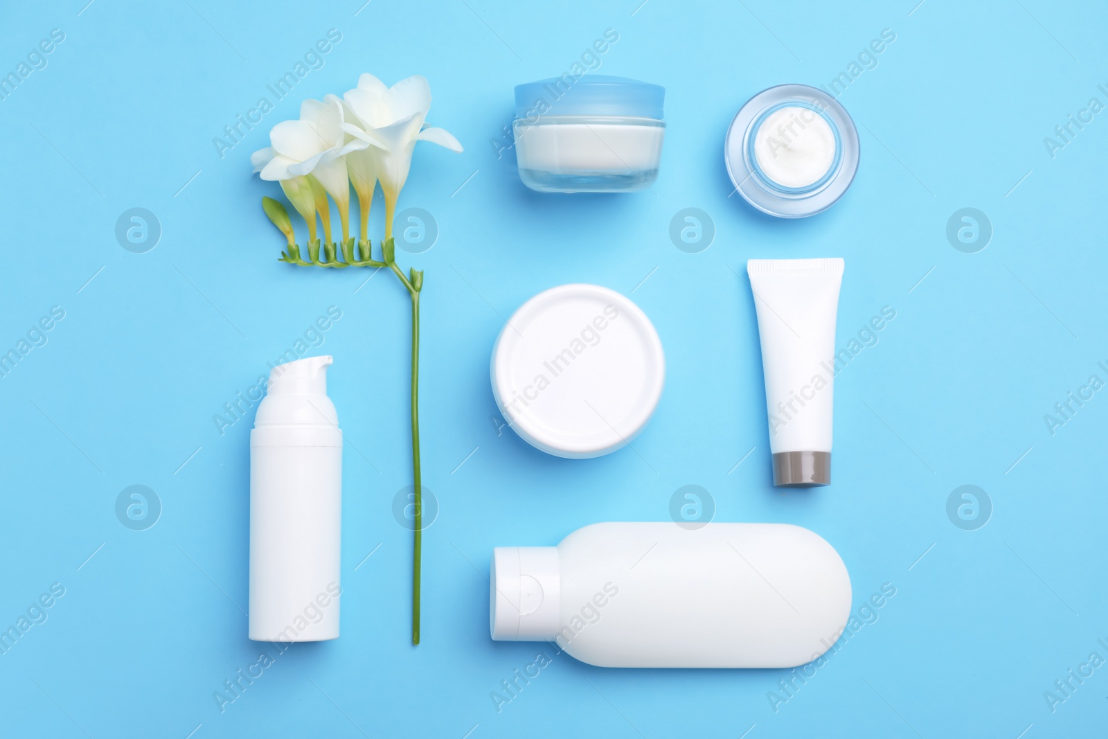 Photo of Flat lay composition with cosmetic products on color background