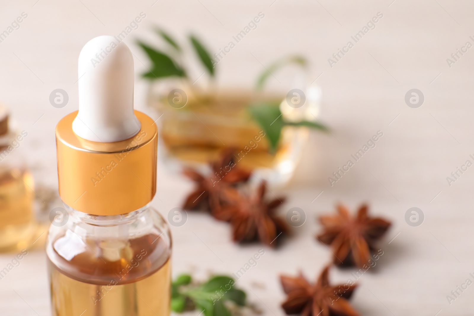 Photo of Bottle of anise essential oil, closeup. Space for text