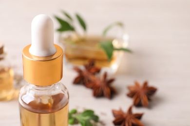 Photo of Bottle of anise essential oil, closeup. Space for text