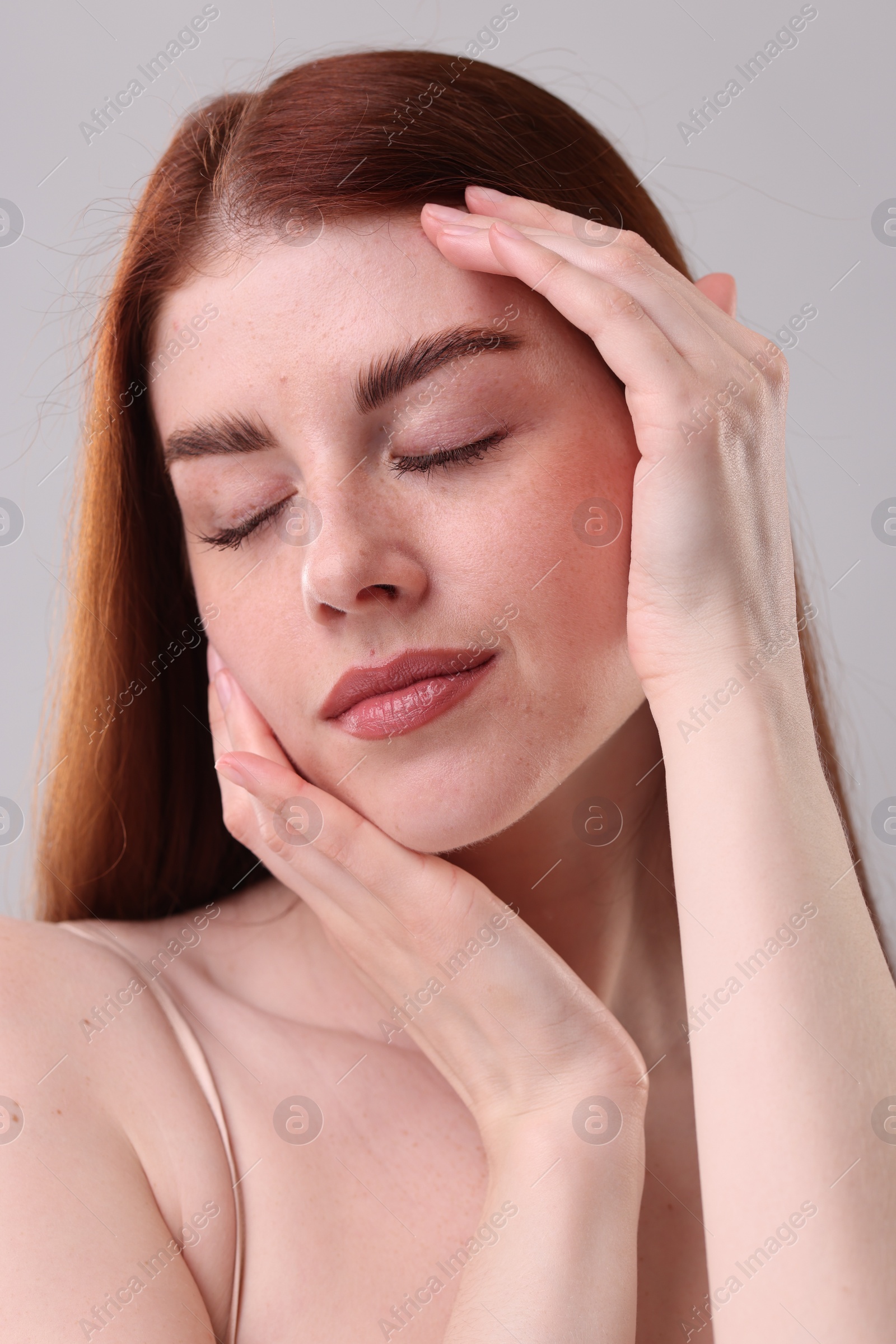 Photo of Portrait of beautiful woman on grey background, closeup