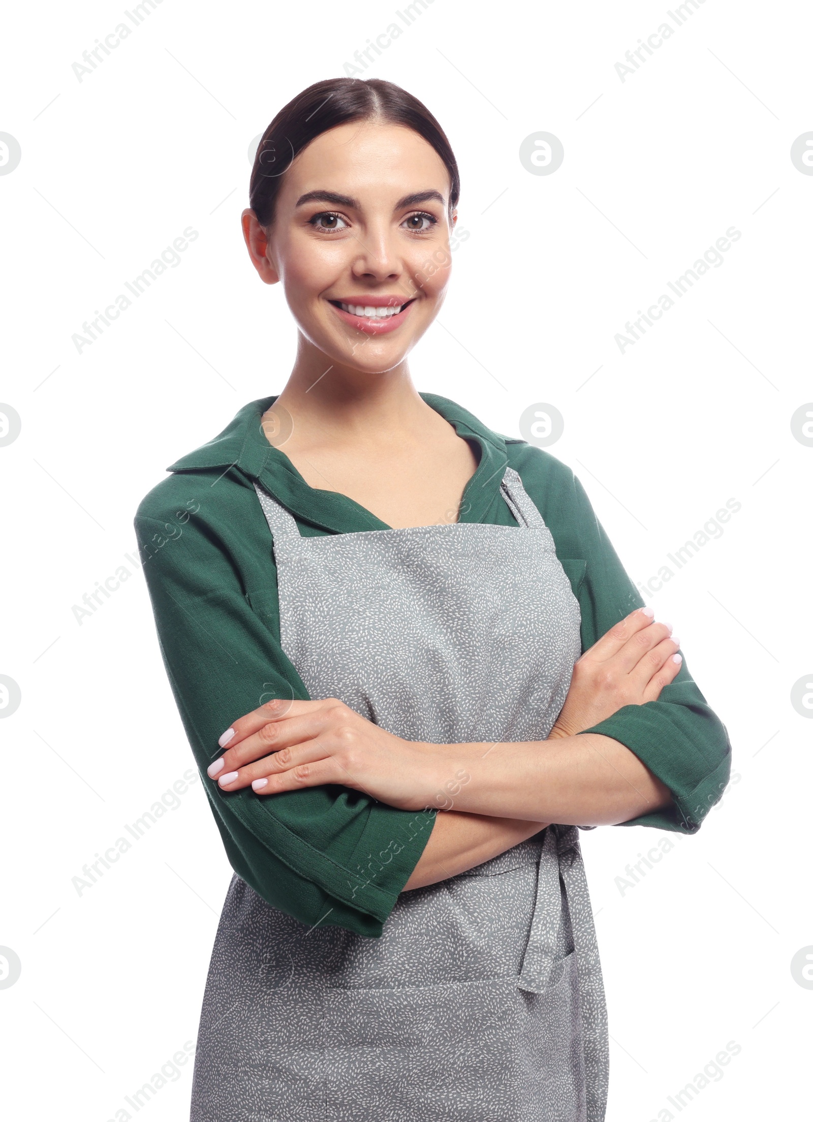 Photo of Young woman in grey apron on white background