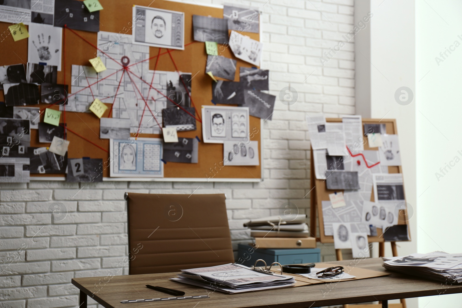 Photo of Modern detective office with workplace and board