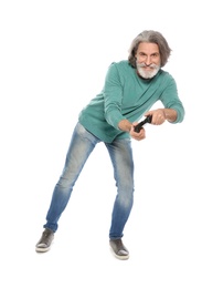 Emotional mature man playing video games with controller isolated on white