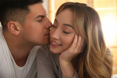 Photo of Lovely couple enjoying time together at home