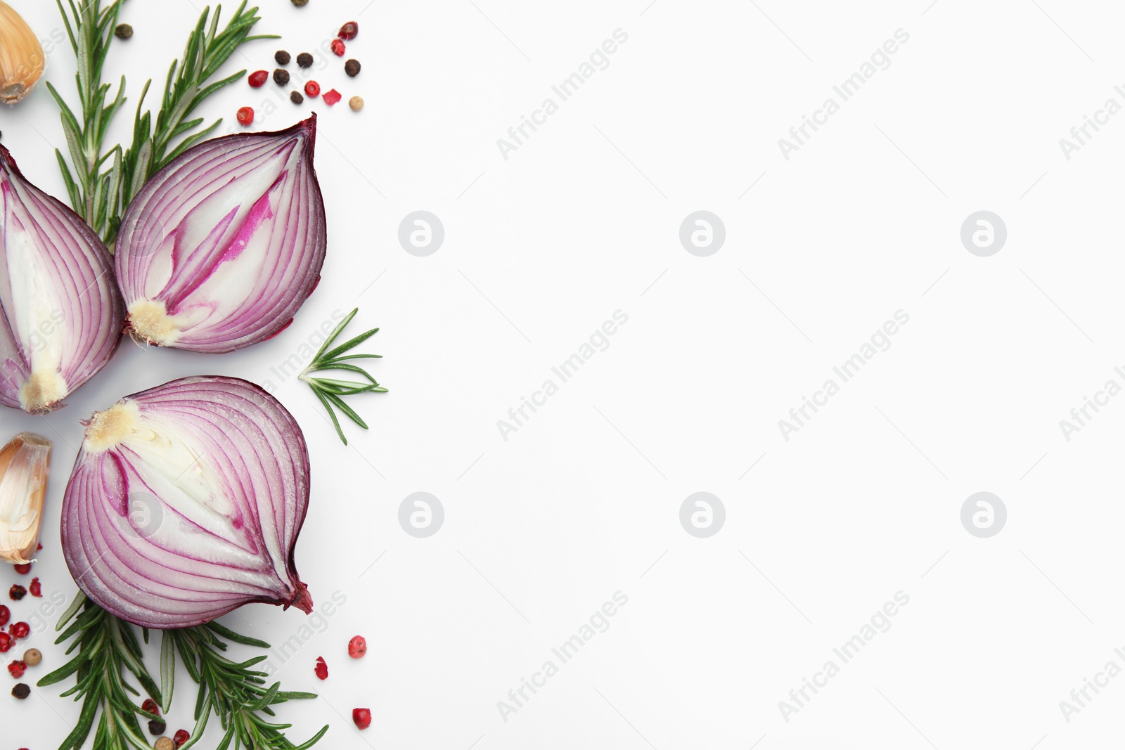 Photo of Fresh red onions, garlic, rosemary and spices on white background, flat lay. Space for text