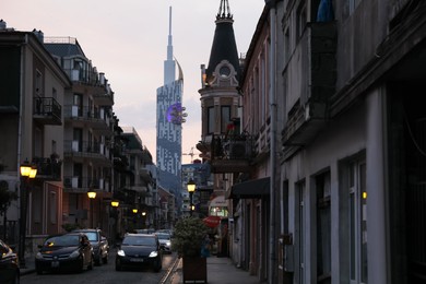 BATUMI, GEORGIA - MAY 31, 2022: Beautiful city street with buildings and cars in evening