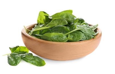 Fresh green healthy baby spinach leaves in wooden bowl isolated on white