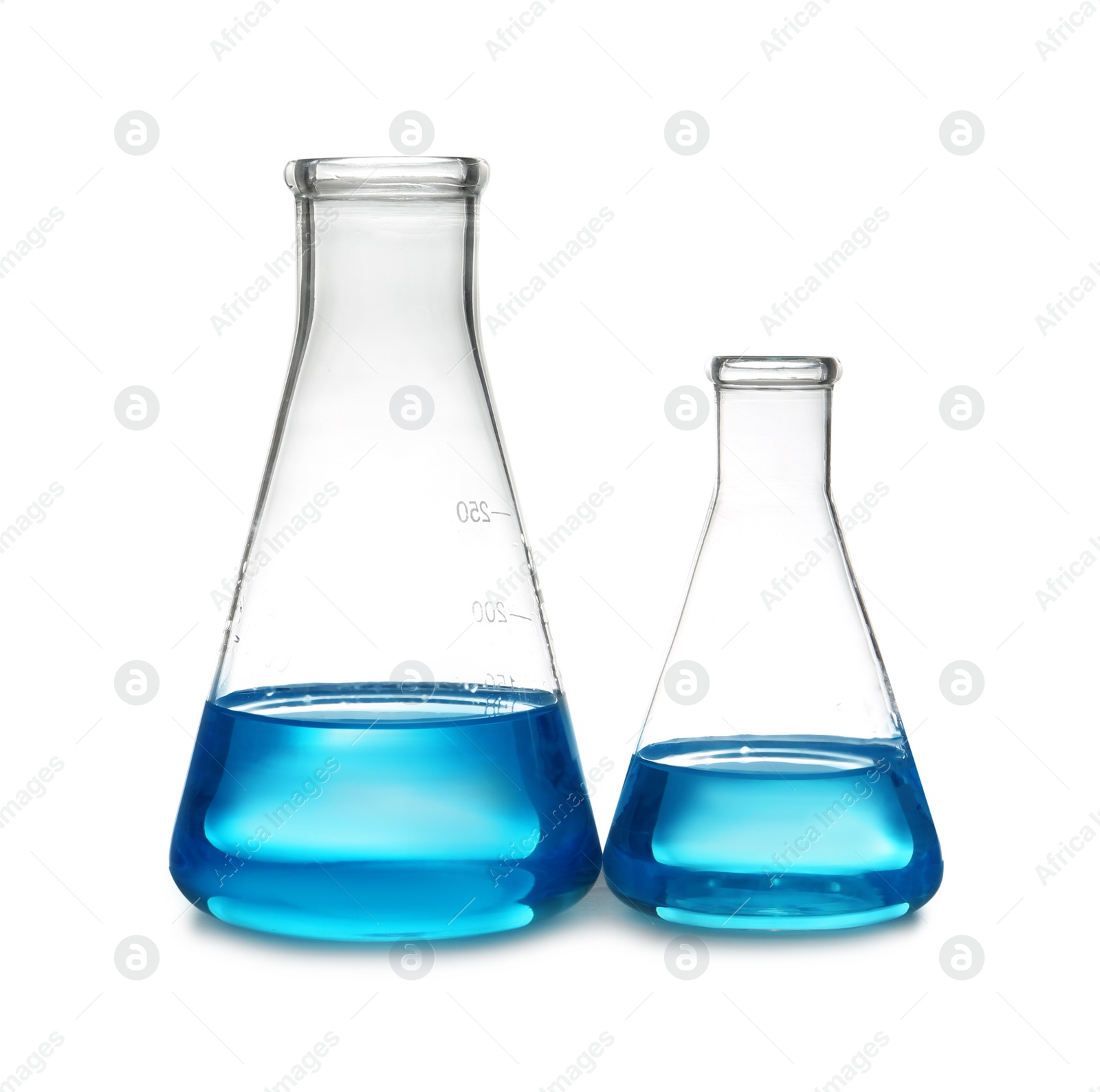 Photo of Conical flasks with liquid on table against white background. Laboratory analysis