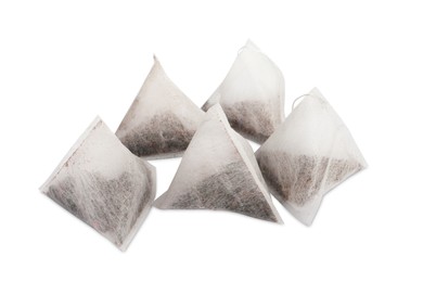 Many new pyramid tea bags on white background