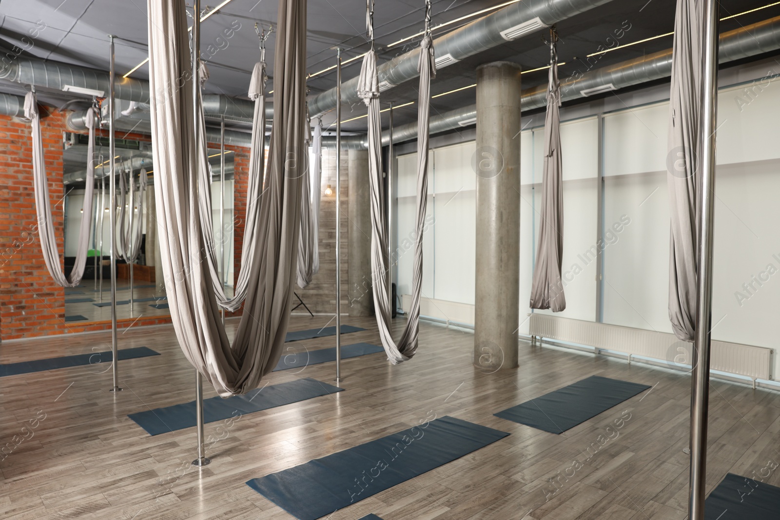 Photo of Many hammocks for fly yoga in studio