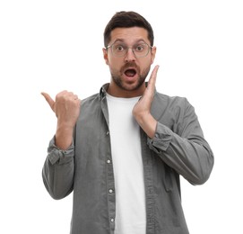 Photo of Special promotion. Emotional man pointing at something on white background