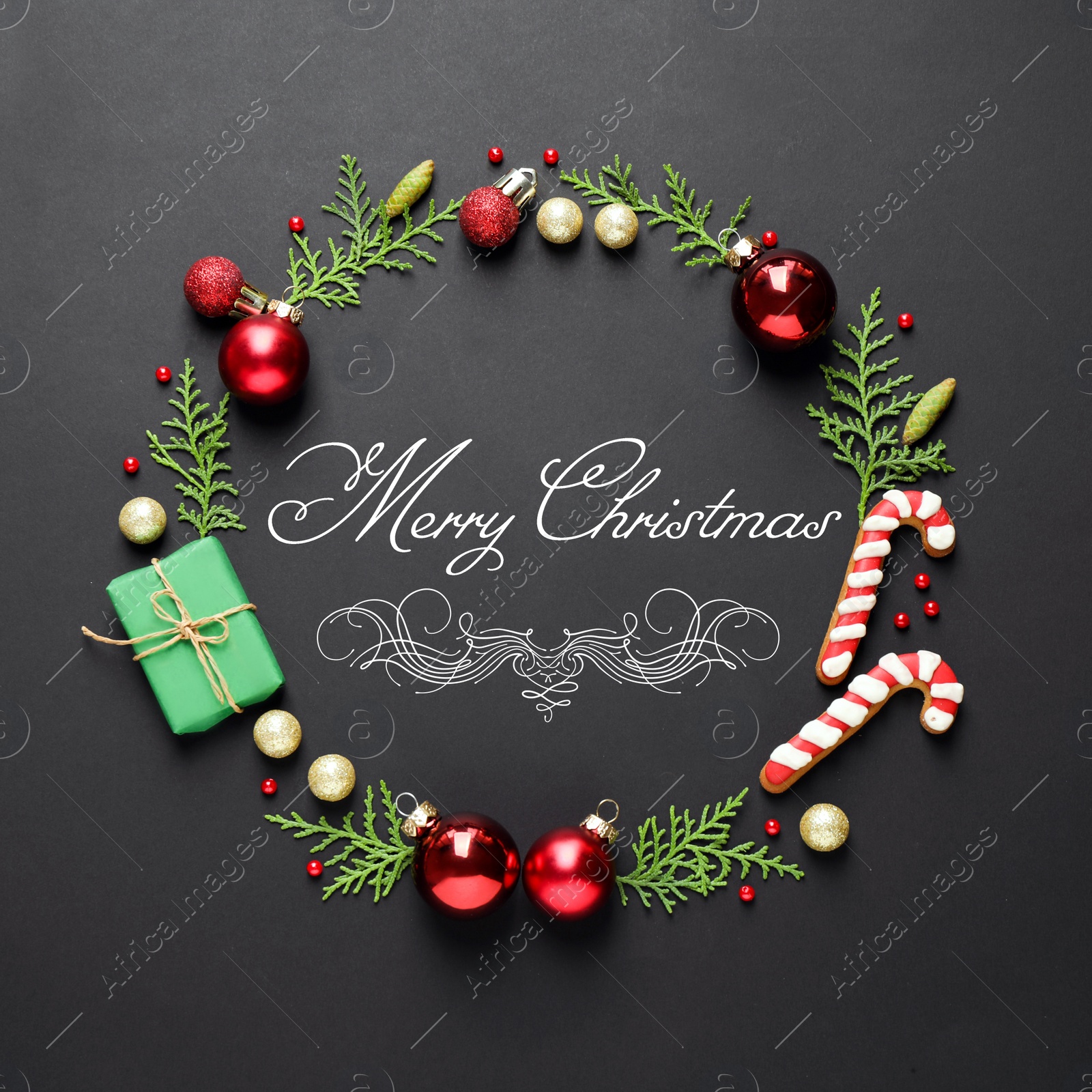 Image of Flat lay composition with text MERRY CHRISTMAS and festive decor on black background