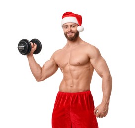 Attractive young man with muscular body in Santa hat holding dumbbell on white background