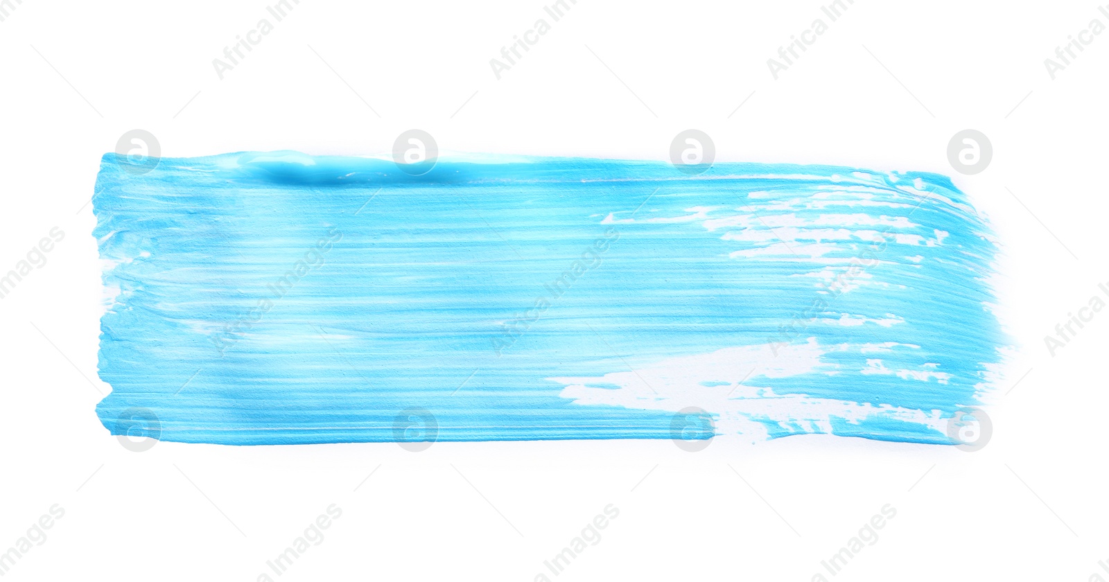 Photo of Abstract brushstroke of blue paint isolated on white