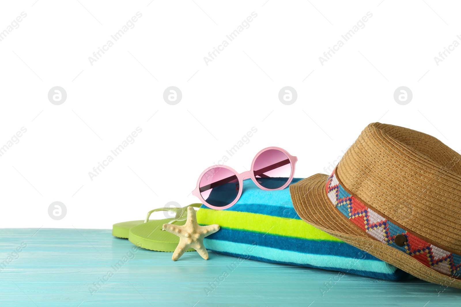 Photo of Set of beach accessories on table against white background. Space for text