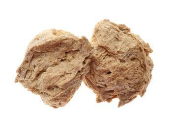 Dehydrated soy meat chunks on white background, top view