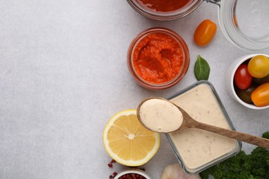 Photo of Different marinades and products on light table, flat lay. Space for text