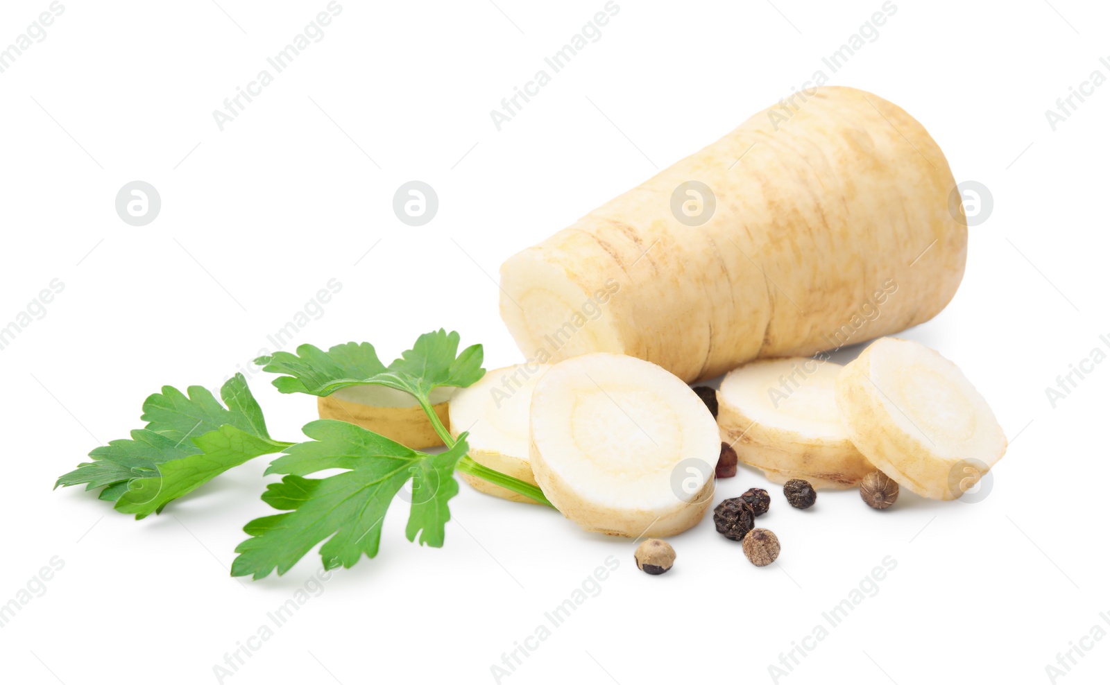 Photo of Whole and cut raw parsley root, fresh herb isolated on white