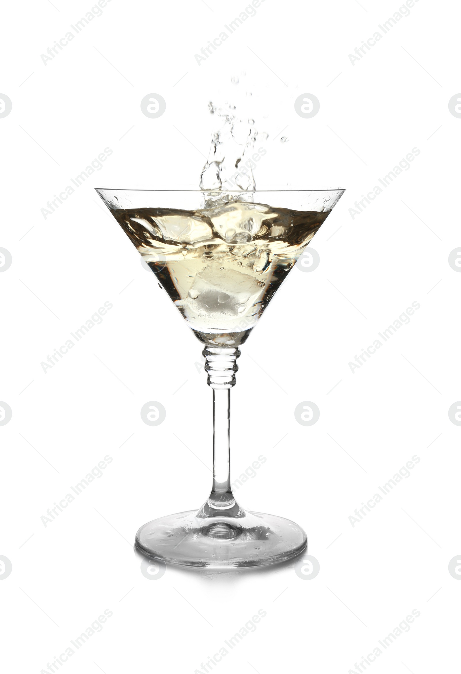 Photo of Glass of classic martini with splash on white background