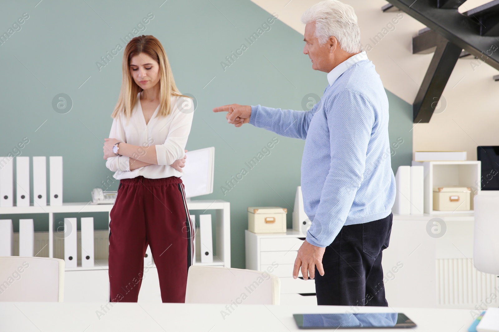 Photo of Office employees having argument at workplace