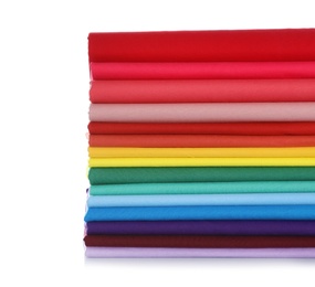 Photo of Pile of colorful t-shirts on white background