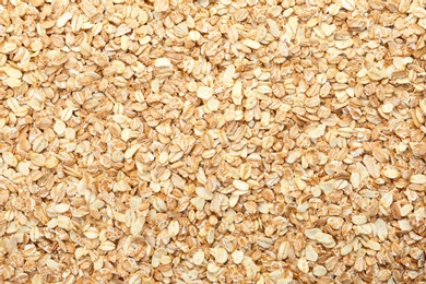 Photo of Raw oatmeal as background. Healthy grains and cereals