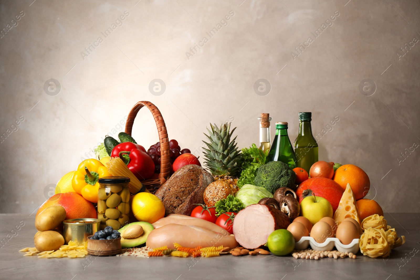 Photo of Different products on grey table. Healthy food and balanced diet