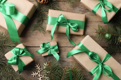 Flat lay composition with gift boxes and Christmas decorations on wooden table