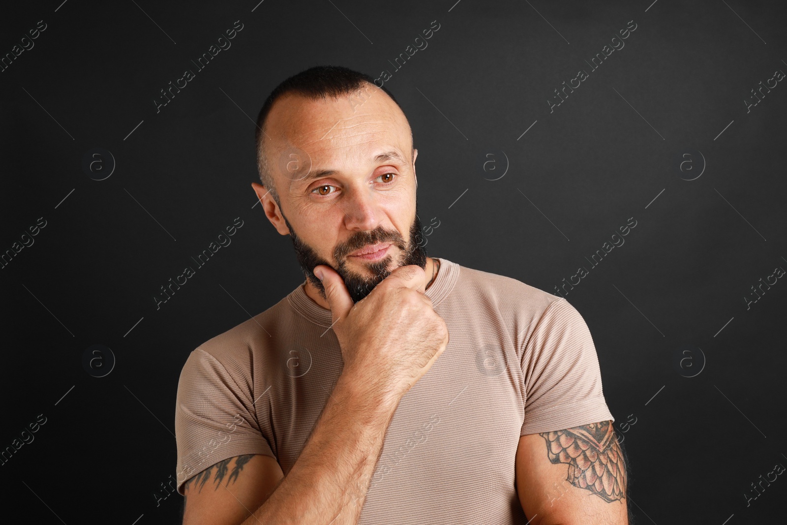 Photo of Portrait of handsome man on black background