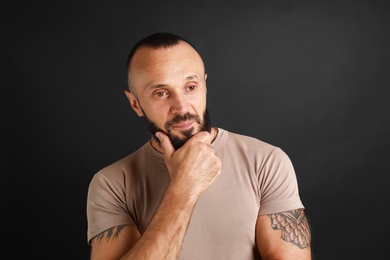 Photo of Portrait of handsome man on black background